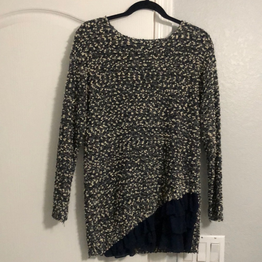 Navy/white sweater with navy frill at the bottom